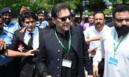 Pakistan’s former prime minister Imran Khan leaves after appearing in the supreme court in Islamabad on 24 July