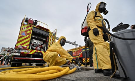 Rescue workers and police officers attend anti-radiation drills in case of an emergency situation at Zaporizhzhia nuclear power plant