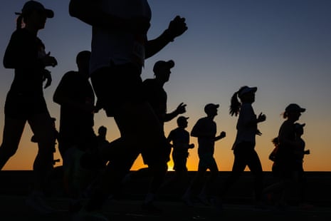 Competitors run across the Sydney Harbour Bridge during the 2023 event