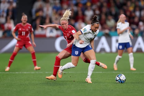 Lucy Bronze loses possession in the middle of the park.