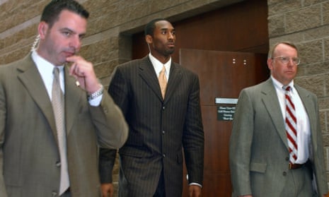 Kobe Bryant prepares to leave for a lunch break from proceedings in his sexual assault case as members of his security team accompany him, in Eagle, Colorado, on 24 March 2004.