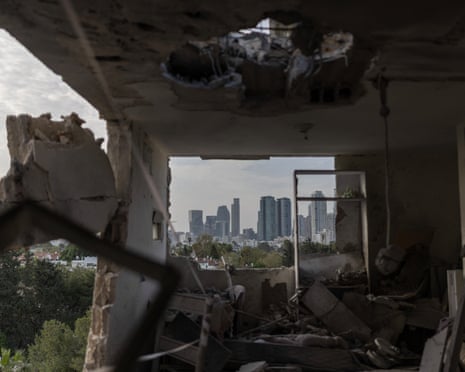 A destroyed apartment, with the Tel Aviv skyline visible, following Iranian missile strikes