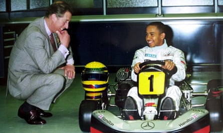 Hamilton meeting Prince Charles at the McLaren headquarters in 1999.