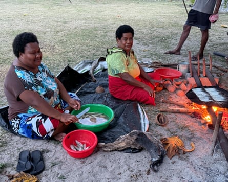 Women in Nacula prepare food.