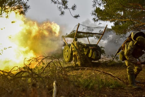 Ukrainian servicemen fire a howitzer towards Russian positions in the Donetsk region, eastern Ukraine, 26 February 2023