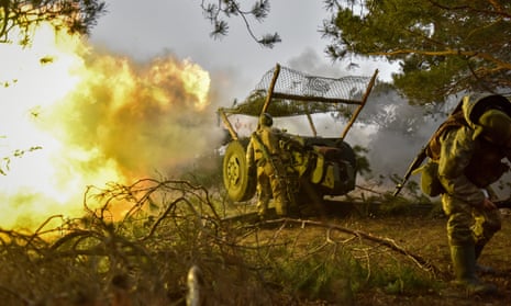 Ukrainian servicemen fire howitzer towards Russian positions in the Donetsk region.