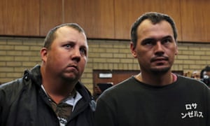 Theo Martins (left) and Willem Oosthuizen appear in court at the Middleburg magistrates high court, in Mpumalanga province.