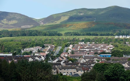 Housing with solar panels at Penicuik with the Pentland Hills beyond