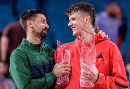 Jakub Mensik shares a word with Novak Djokovic after the match