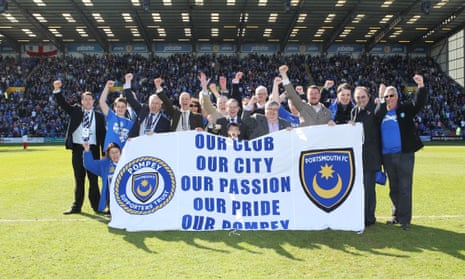 Portsmouth’s supporters’ trust celebrate after taking over the club in 2013. Its members will decide this month whether to sell to the US businessman Michael Eisner.