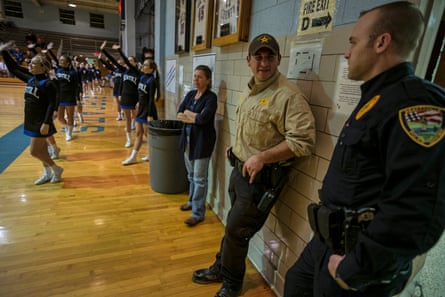 Deputy Sherrif David Stamper stops off at the Saturday local college basketball game.