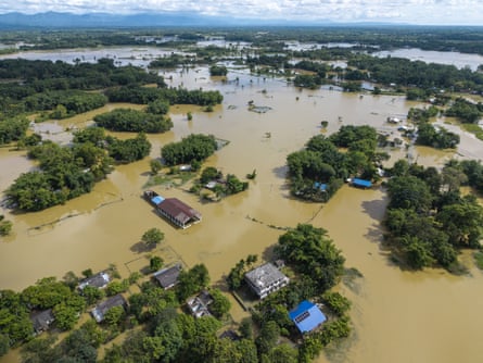A flooded region in india with homes and trees submerged