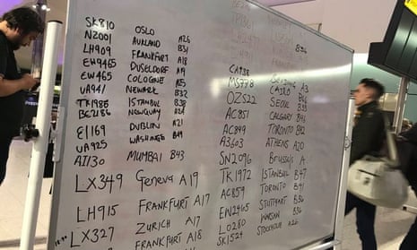 Flight information displayed on whiteboard at Heathrow airport
