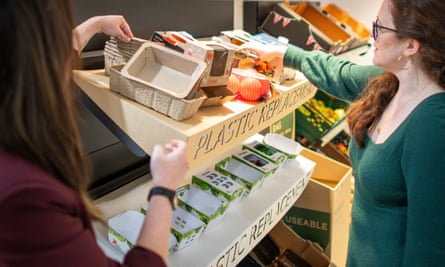 Butler, left, and Amy Cross, customer engagement manager, showing card replacement options.