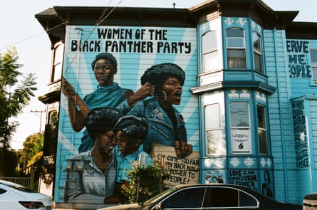 A house in Oakland that is painted mainly blue and features a mural of four woman and the words: ‘Women of the Black Panther Party’.