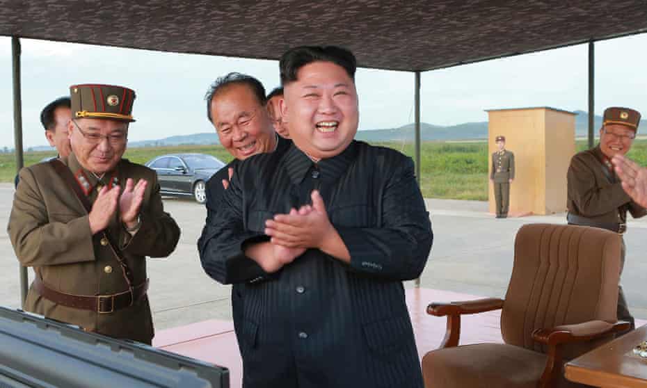 North Korean leader, Kim Jong-Un, celebrates what was said to be the test launch of an intermediate range missile.
