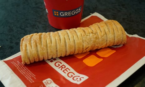 A Greggs vegan sausage roll and hot drink.