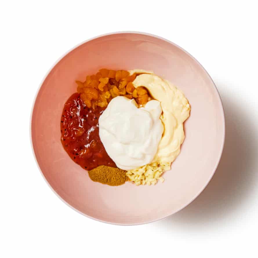 Felicity Cloake’s Coronation chicken 8a Put the ginger and apricots in a large bowl with the chutney and curry powder. Stir in the Worcestershire sauce, then fold in the mayonnaise and yoghurt until evenly mixed and no streaks remain. Season to taste, then fold in the chicken and leave to mingle for at least an hour – if you’re making it further ahead, refrigerate.