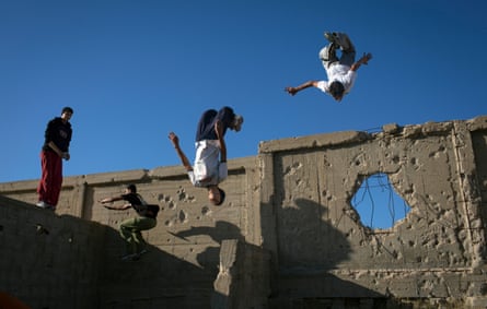 the Gaza Parkour and Free-running team at a cemetery near their refugee camp