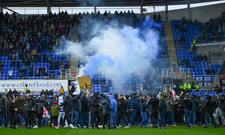 Fans protest on the pitch at Reading, leading to their League One game being abandoned on 13 January 2024