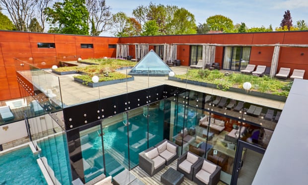A look down at the pool area at Ockenden Manor, with rooftop garden also in shot
