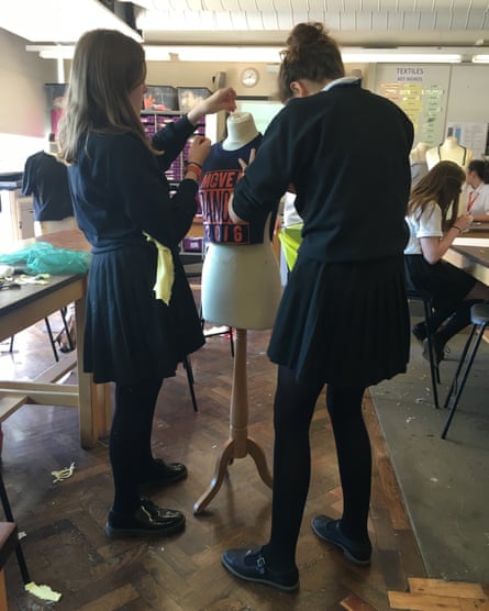 Students use an old t-shirt to create a new piece of clothing.