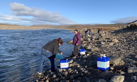 Residents collect water from the Sylvia Grinnell River near Iqaluit. The city’s investigation into its main drinking water source began last week after residents complained their tap water had a gasoline-like smell.