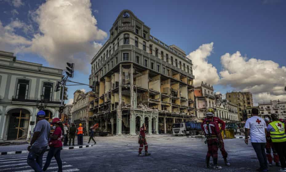 Rescue workers in front of the Hotel Saratoga in Havana which was wrecked by a blast on 6 May.