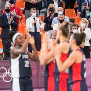 Emmanuel Macron and Jill Biden watch basketball at the 2021 Tokyo Olympics.