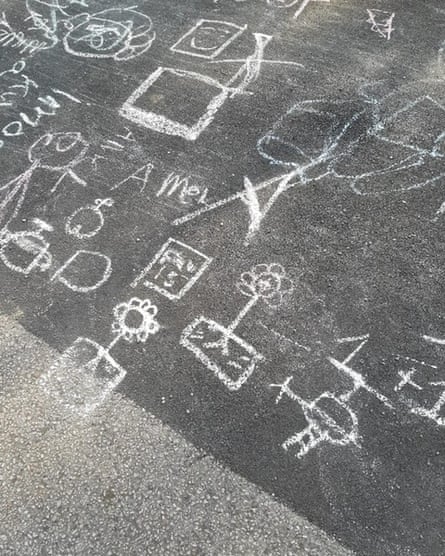 Chalk drawings made by the children on a hotel car park