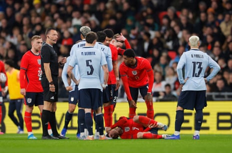 Phil Foden lies injured after a challenge from Ronald Araujo