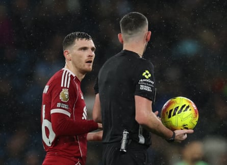 Andy Robertson (left) remonstrates with the referee, Chris Kavanagh