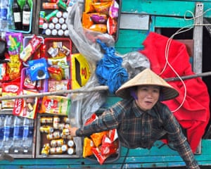 Halong Bay, Vietnam ‘This was taken from a cruise ship. I was on deck and heard some shouting from sea level, looked over and there was a lady right below me, who had rowed out into the middle of the bay to sell drinks to passengers. It was a case of right moment, right camera round my neck.”