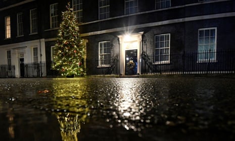 10 Downing Street at night with a large Christmas tree