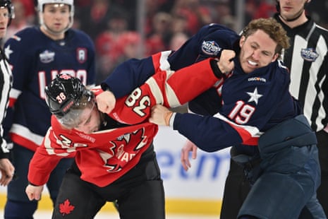Matthew Tkachuk of Team USA, right, fights with Brandon Hagel of Team Canada during the first period of their 4 Nations Face-Off game on Saturday night at the Bell Centre in Montreal.