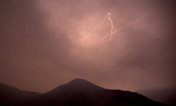 Lightning flashes over Siskiyou county, California, last month.  Lightning strikes sparked new wildfires for crews battling the McKinney fire nearby.