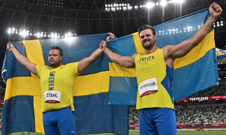 Daniel Stahl (L) and silver medallist Sweden’s Simon Pettersson celebrate.