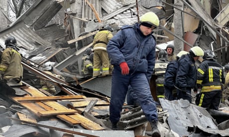 Emergency workers conduct rescue work at Kalininsky district in Donetsk, Ukraine on 16 January 2023.