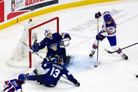 United States forward Will Horcoff attempts a shot against Finland