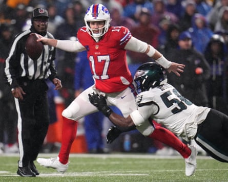 Buffalo Bills quarterback Josh Allen evades a sack during a game against the Philadelphia Eagles.