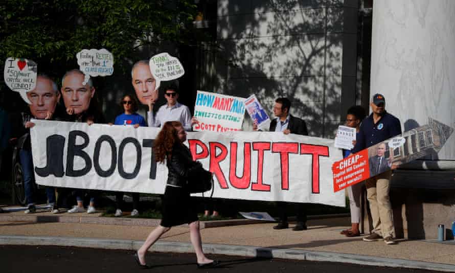 People protest before the EPA administrator, Scott Pruitt, testifies before a House energy and commerce subcommittee in Washington last month.