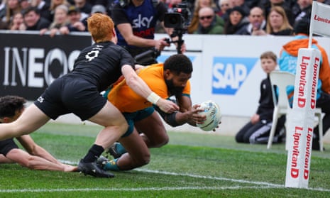 Australia's Marika Koroibete dives over to score a try in the Bledisloe Cup Test between the All Blacks and Australia in Dunedin.