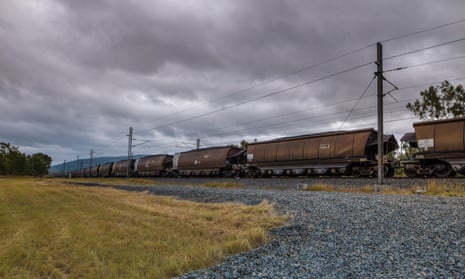 Passing Coal Train Under Overcast Skies