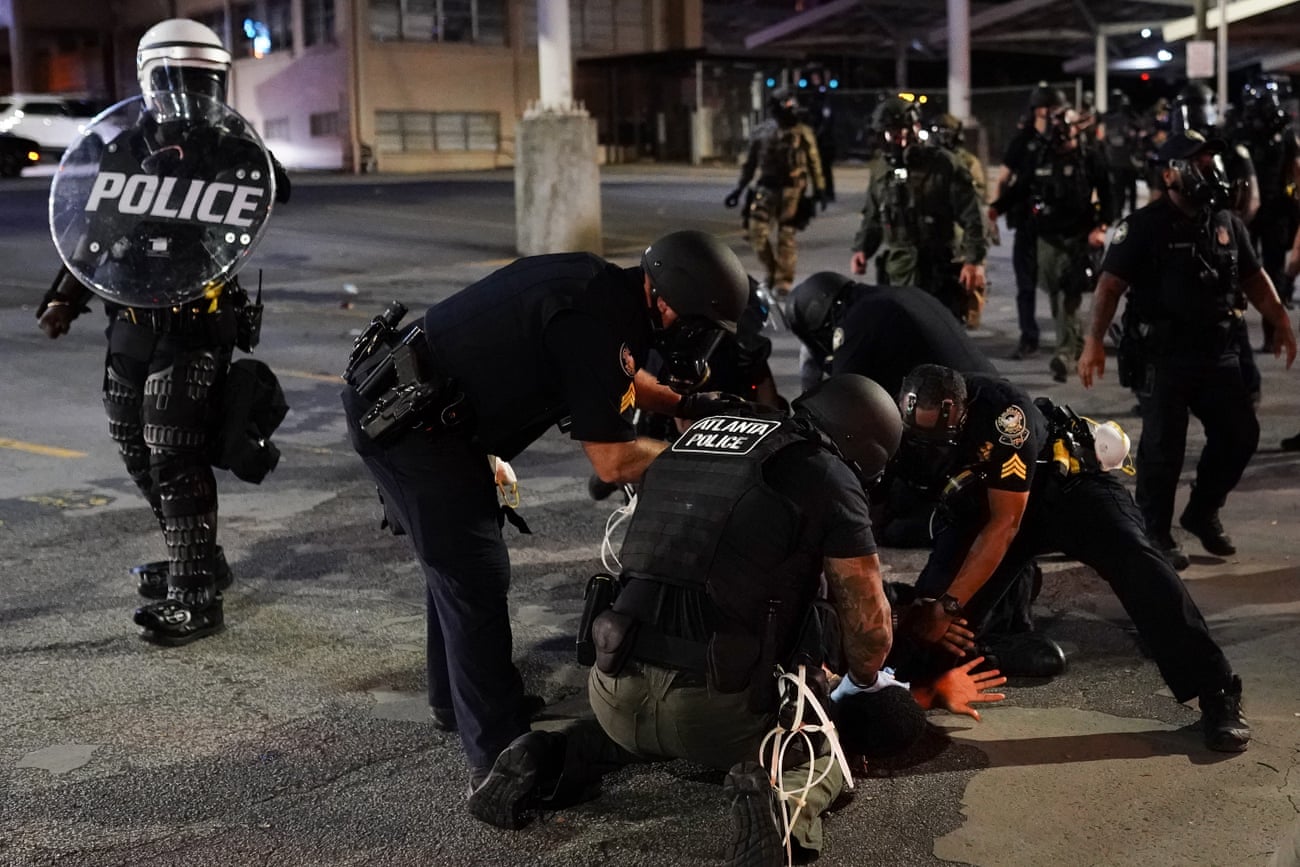 Police detain a protester on 30 May in Atlanta, Georgia.