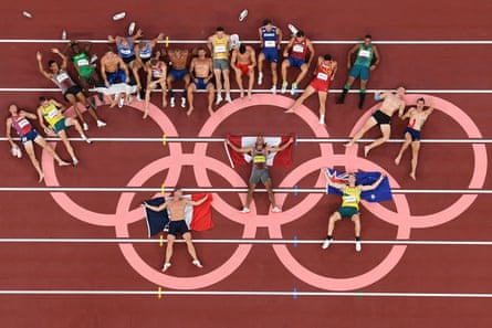 Aerial photo of gold medallist Canada’s Damian Warner (C), silver medallist France’s Kevin Mayer (L) and bronze medallist Australia’s Ashley Moloney (R) posing after the men’s decathlon event