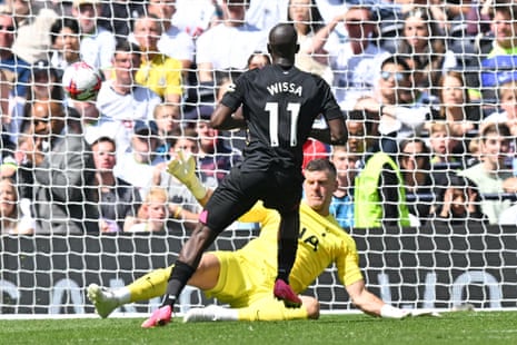 Brentford's Yoane Wissa scores his team's third goal past Tottenham keeper Fraser Forster.