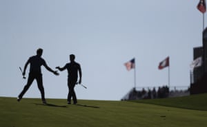 Thomas Pieters congratulates Rory McIlroy as they build a strong lead after 10.
