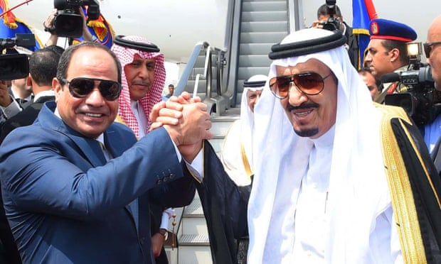 President Abdel Fatah al-Sisi, left, shakes hands with King Salman