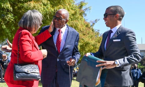 The civil Rights attorney Fred Gray, centre, shares a moment with his wife Carol, left, and Montgomery’s mayor, Steven Reed, during a ceremony on 26 October in which Jeff Davis Avenue was renamed Fred D Gray Avenue.