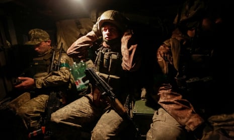 Ukrainian service personnel inside a mine resistant ambush protected (MRAP) Bushmaster vehicle near Bakhmut